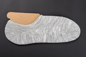 grey socks for men on a black background