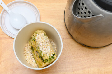 pork and mushroom flavor instant  porridge with kettle nearby