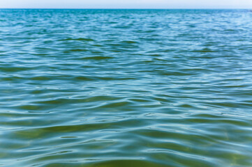 Smooth green water. Clear water surface. Background water.