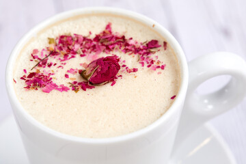 tasty cappuccono with rose petals