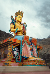 Maitreya Buddha statue near the Diskit Gompa (Diskit Monastery) in the Nubra Valley of Ladakh, northern India. - obrazy, fototapety, plakaty