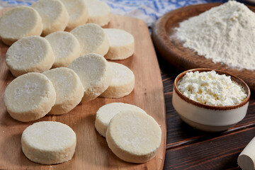 raw cottage cheese pancakes on the wooden board