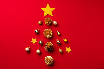 Red Christmas composition with gold cones and decorations