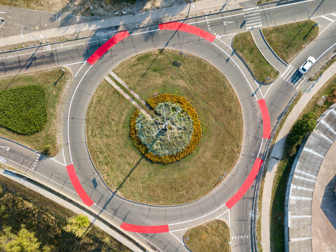 Aerial drone view. Roundabout with red bicycle markings.