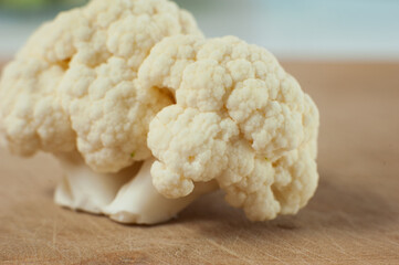 Cauliflower on a wooden Board. Macro photo. Selective focus.