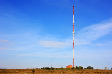 Cell tower stands in the field