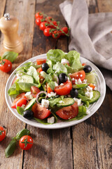tomato salad with cucumber, lettuce and cheese