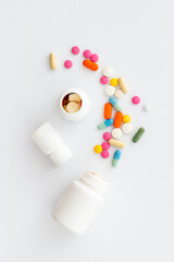 Pills bottle with medicines and vitamins, view from above