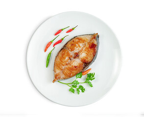 King mackerel or spotted mackerels steak with dish isolated on white background ,fried Scomberomorus fish ,include clipping path