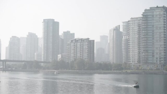 Small Tender in Flase Creek Harbour | Smokey city skyline | Air pollution from California forrest fire smoke