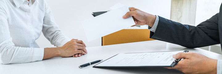 Hand of employer filing final remuneration after employee to write a document letter of...