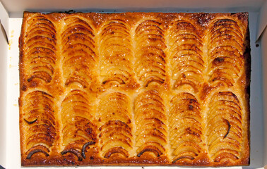 Tarte tatin: a rectangular French apple pie in a white paper box.