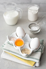 Fototapeta na wymiar white eggs and egg yolk on a ceramic stand