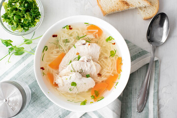 chicken soup with noodles and herbs