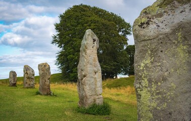 Impressive standing stones from the historic circle in Avebury Wiltshire. Sheep can be seen grazing...