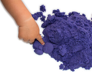 child plays with kinetic sand of bright purple color isolate on white background. classes have a...