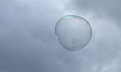 giant soap bubbles explode at the touch of children's hands