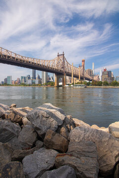 Long bridge crossing the East River and Roosevelt Island heading to Manhattan. 