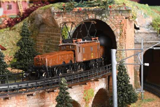 Florence, ITALY - December 2019: Miniature railway model with landscape, city and Crocodile electric locomotive model.