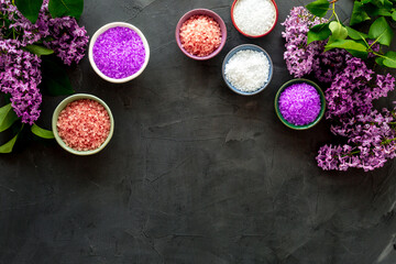 Obraz na płótnie Canvas Bath spa set with sea salt and purple flowers. Top view