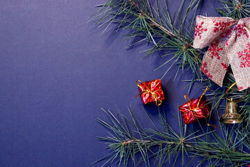coniferous branches and Christmas tree decorations on a New Year's dark background, copy space