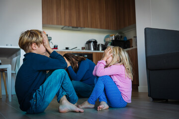 family problems - sad kids, tired and exhausted mother