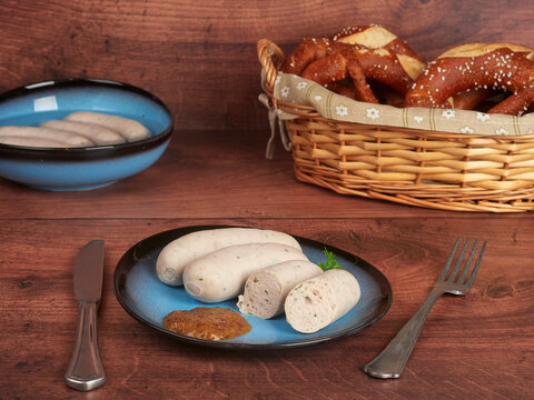 Bavarian white sausages (weisswurst) with sweet mustard and pretzels