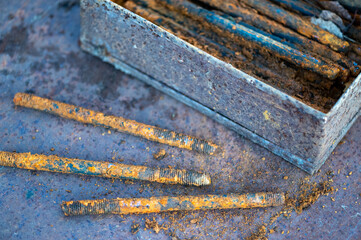metal stud, fasteOld metal studs covered in rust, close-up, selective focus.ning part, rust