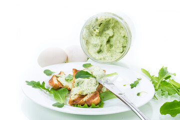 green bread spread of arugula, curds and eggs with fried toast