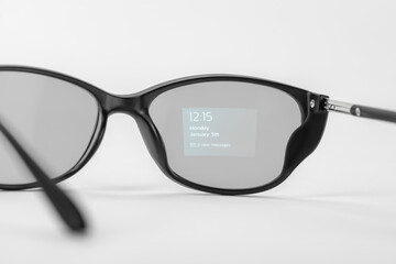 Time, date and notification projected on smart glasses' lens