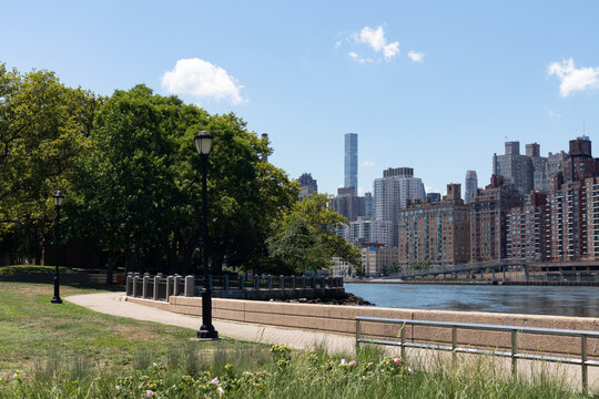 Green Grass at Lighthouse Park on Roosevelt Island in New York City during Summer with an Upper East Side Manhattan Skyline View