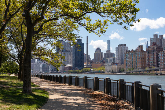 Empty Riverfront Path on Roosevelt Island in New York City during Summer with an Upper East Side Manhattan Skyline View