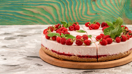 Homemade cheesecake with fresh raspberries and mint for dessert, Delicious cheesecake with berries, healthy organic summer dessert pie cheesecake, Long banner format. space for text