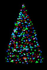 Blurred christmas tree lights isolated on black background