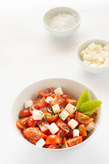 Greek village salad horiatiki with feta cheese, olives, cherry tomato, cucumber and red onion, vegeterian mediterranean food, low calories dieting meal