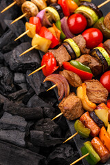 Grilled kebabs with meat, mushrooms and vegetables