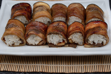 Vegan sushi rice rolled in teriyaki eggplant slices