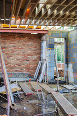 Demolition of the existing wall between the house and new extension. DIY renovation project, selective focus