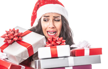 Female with a pile of Xmas presents in her hands falling down, desperate facial expression