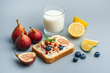 A healthy western breakfast with figs and toast and oatmeal.A western breakfast with fruit and milk