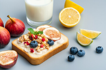 A healthy western breakfast with figs and toast and oatmeal.A western breakfast with fruit and milk