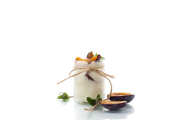 Homemade sweet yogurt with slices of ripe plums in a glass