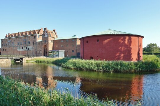 MALMO, SWEDEN -16 AUG 2020- View of the Malmo Castle, a landmark red historic fortress located in Malmo, Sweden.