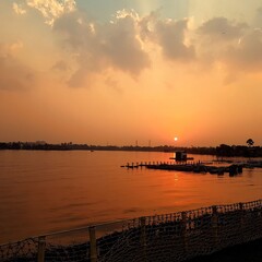 Obraz premium sunset over the river