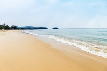 Fototapeta na wymiar Beautiful clean beach on Phuket island in south of Thailand, summer holiday break destination to Asia, Tourist on the beach, cloudy sky with blue sea water