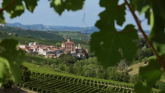 Barolo village with the castle among the hills of Nebbiolo grape vineyards in the Langhe country, Piedmont, Italy