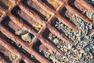 Rusty iron on pebble beach, Falkland Islands