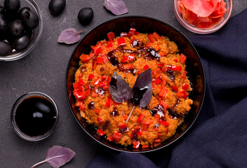 Dish of vegan minced meat with vegetables on black background top view