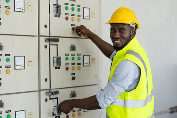 African electrical worker open power circuit breaker voltage switch at warehouse factory