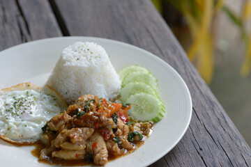 Stir Fried Thai basil with chicken and fried egg.
